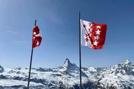 The Best Thing to do in Zermatt: The Matternhorn in the Background with 2 Flags in the front